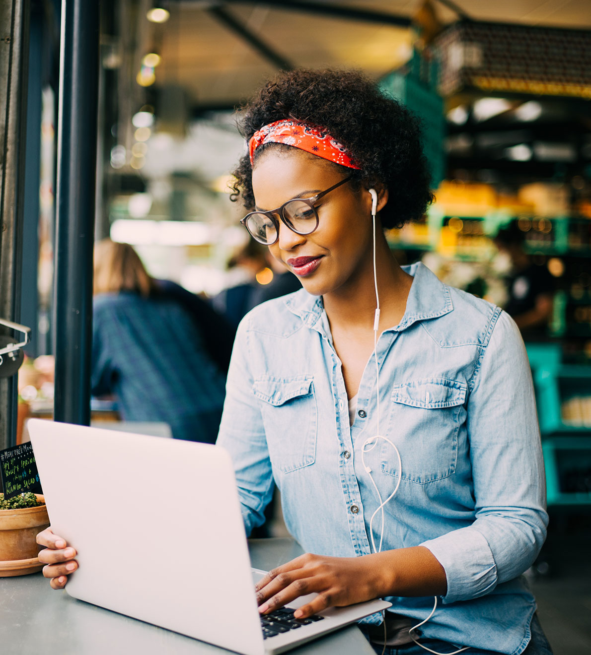 Woman in coffee shop on computer Woman in coffee shop on computer